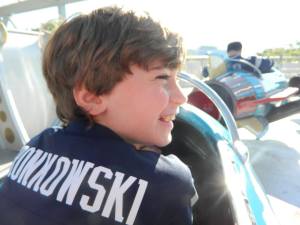 And now… seriously enjoying himself on Astro Orbiter